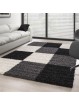 Shaggy rug with long pile and checkered pattern, available in several colors and sizes.