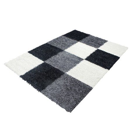 Shaggy rug with long pile and checkered pattern, available in several colors and sizes.